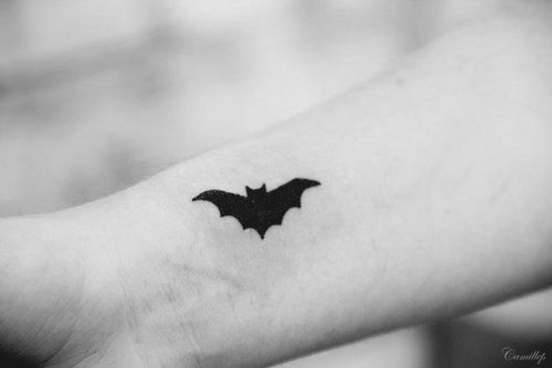 Cute Tiny Black Bat Tattoo On Wrist By Nhi Nho