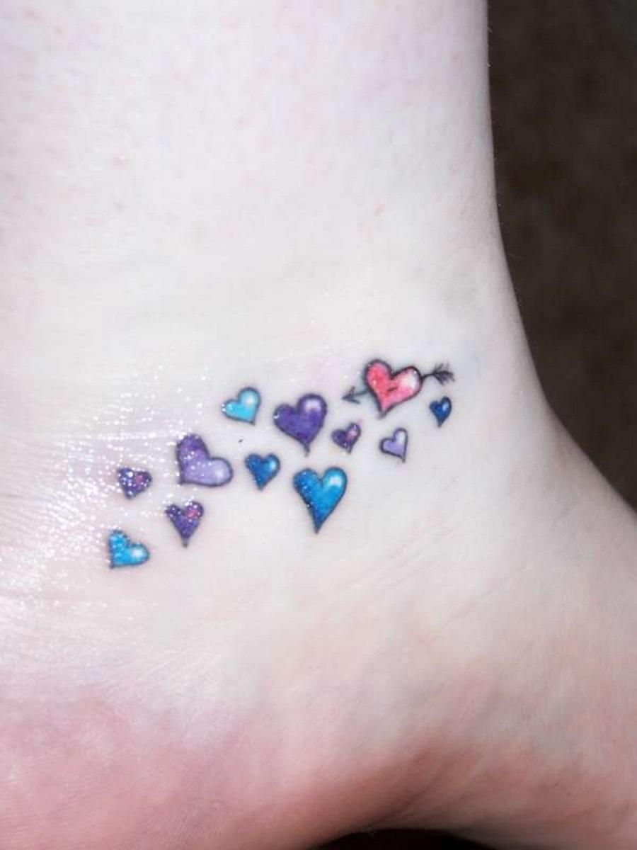 Cute Tiny Colorful Hearts Tattoo On Ankle