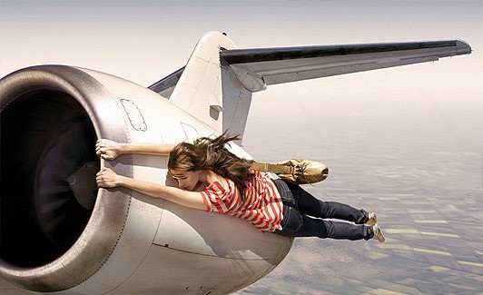 Girl Hanging With Flying Plane Funny Picture