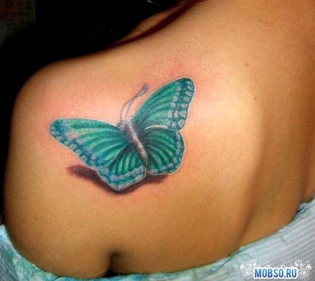 Green 3D Butterfly Tattoo On Girl Left Back Shoulder