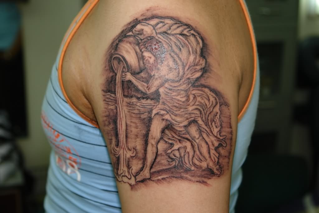 Grey Aquarius Tattoo On Left Shoulder