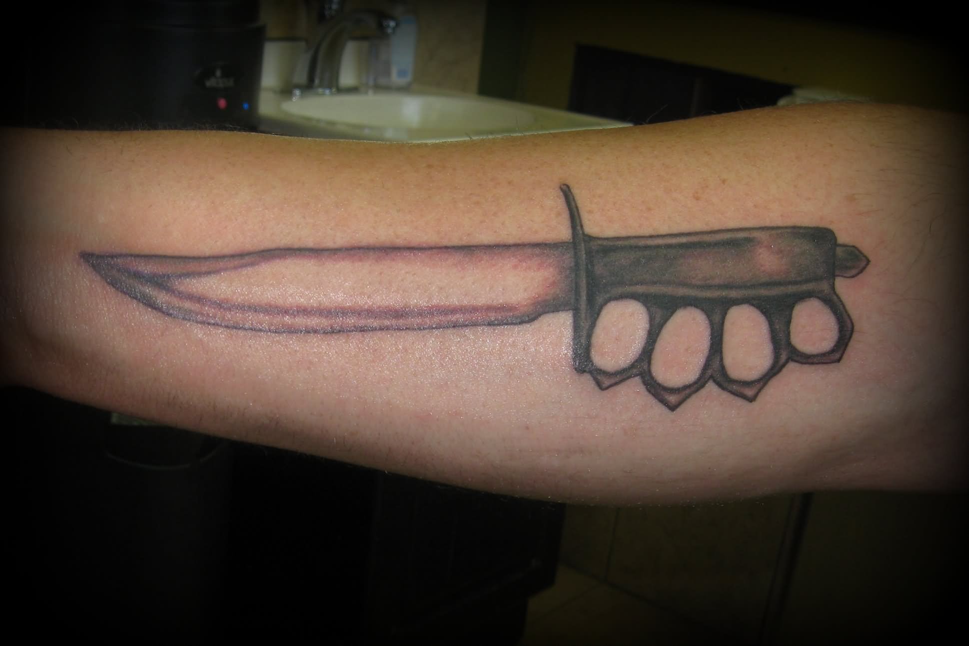 Grey Knife Tattoo On Forearm