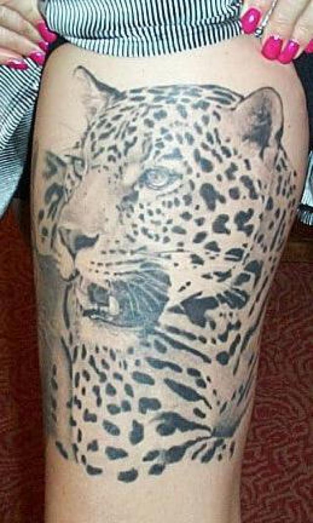 Grey Leopard Tattoo On Girl Thigh