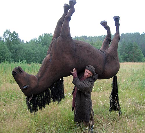 Man Pick Up Horse On His Shoulder Funny Picture