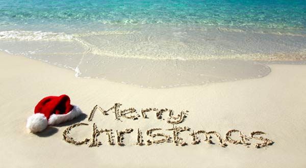 Merry Christmas Written On Beach Sand