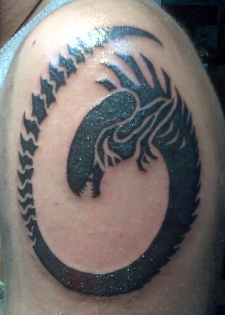 Ouroboros Alien Tattoo On Left Shoulder