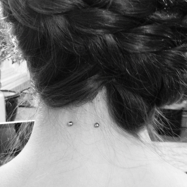 Silver Barbell Neck Piercing Image