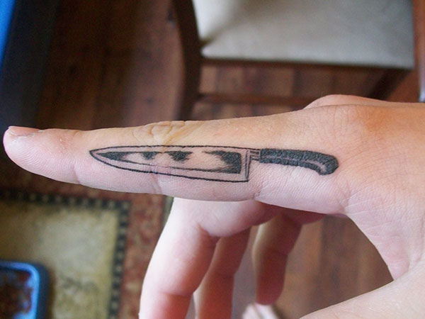 Small Knife Tattoo On Finger