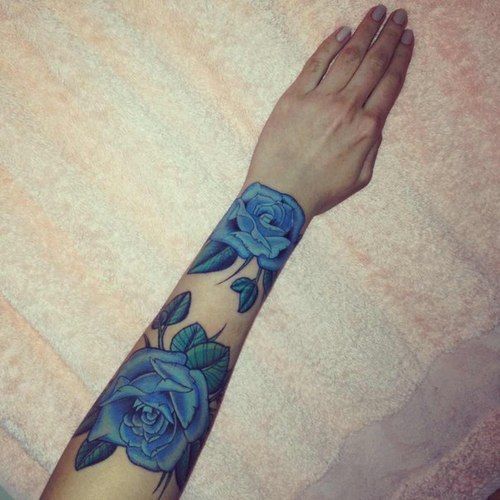 Two Blue Roses Tattoo On Girl Forearm