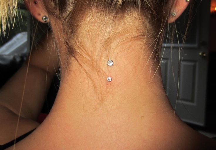Vertical Neck Piercing With Dermal Anchors