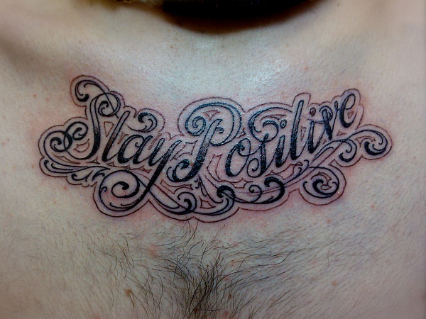 Wonderful Stay Positive Tattoo on chest