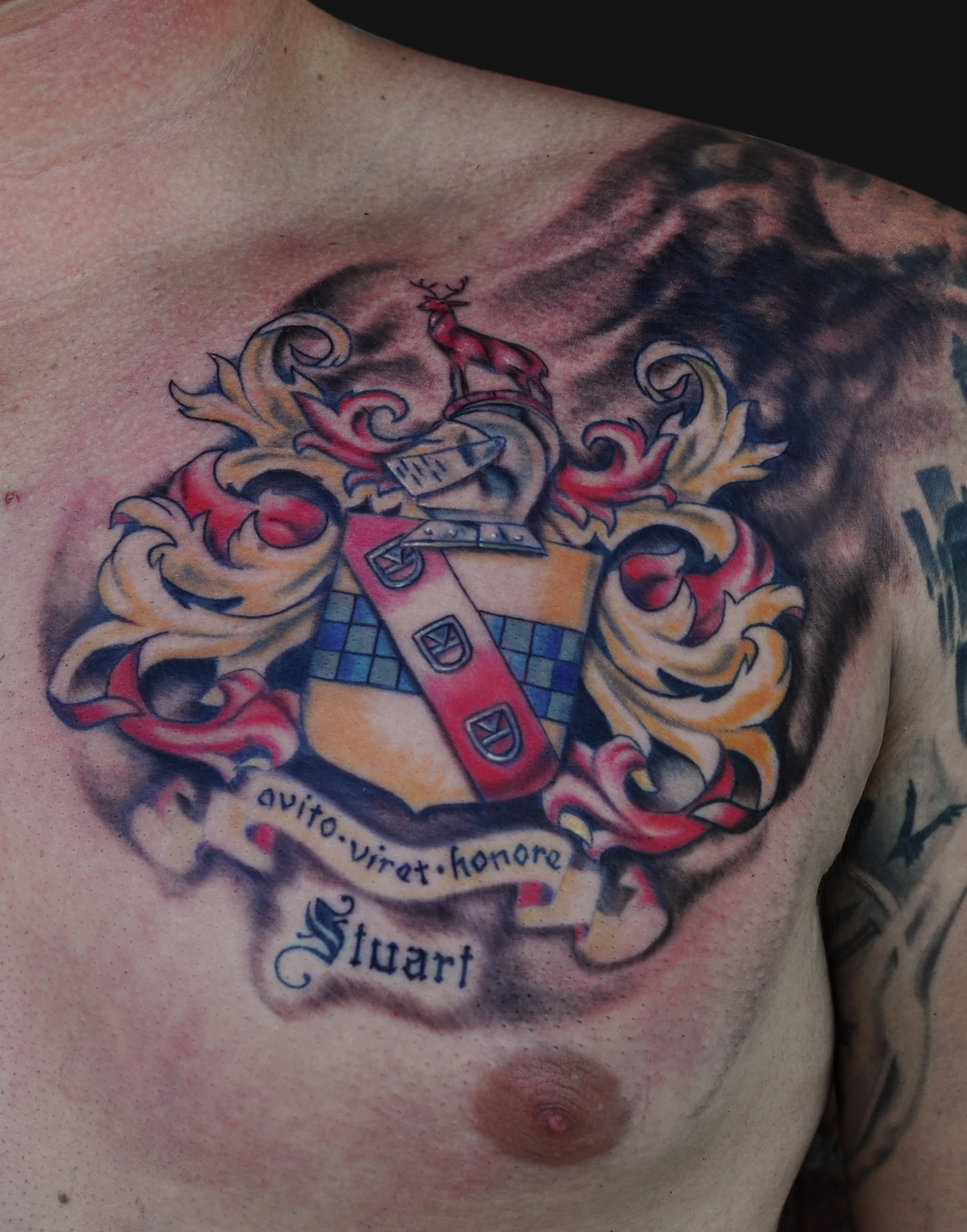 Amazing Colorful Family Crest Tattoo On Man Left Chest