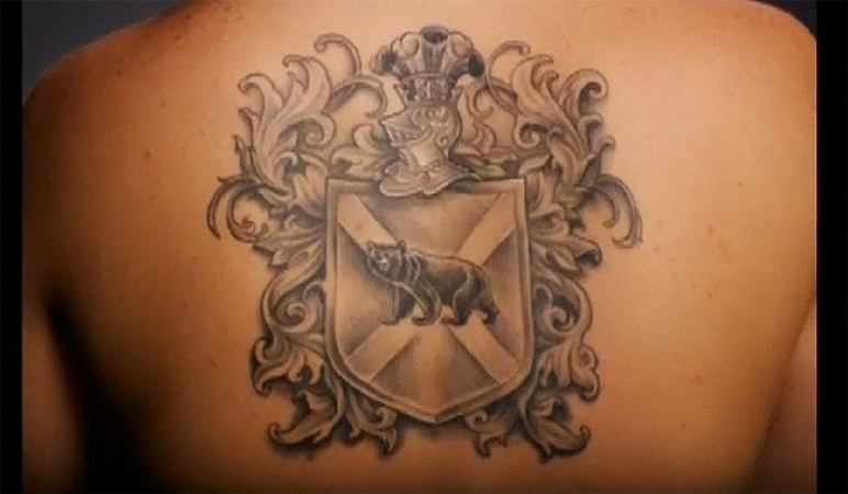 Black And Grey Bear In Family Crest Tattoo On Upper Back