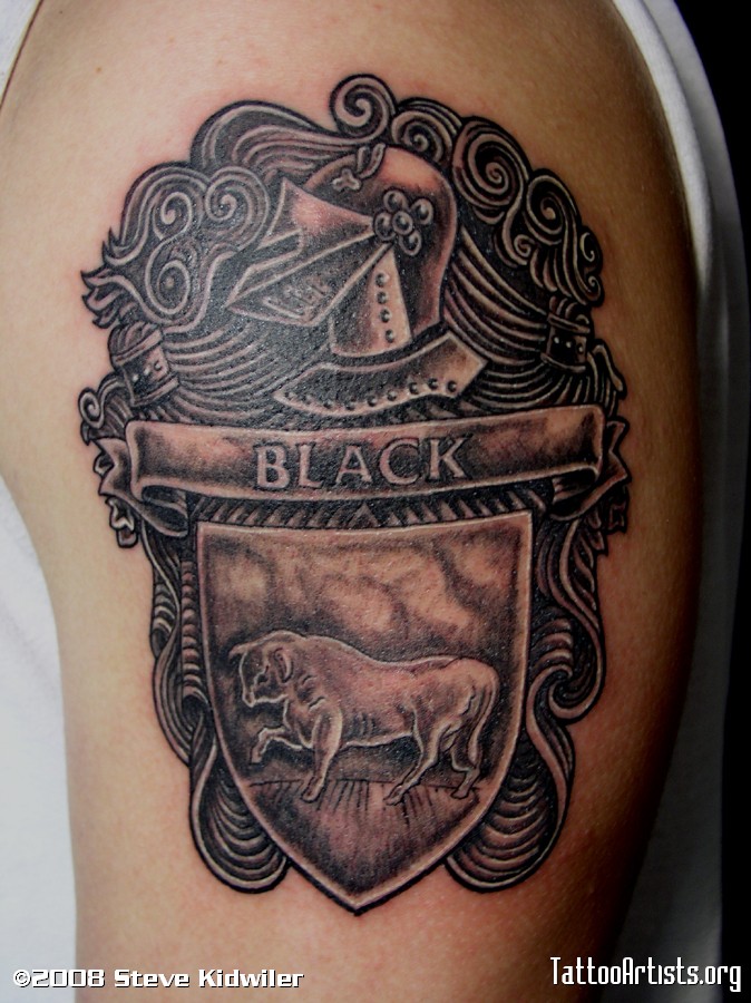 Black And Grey Bull In Family Crest Tattoo On Man Shoulder