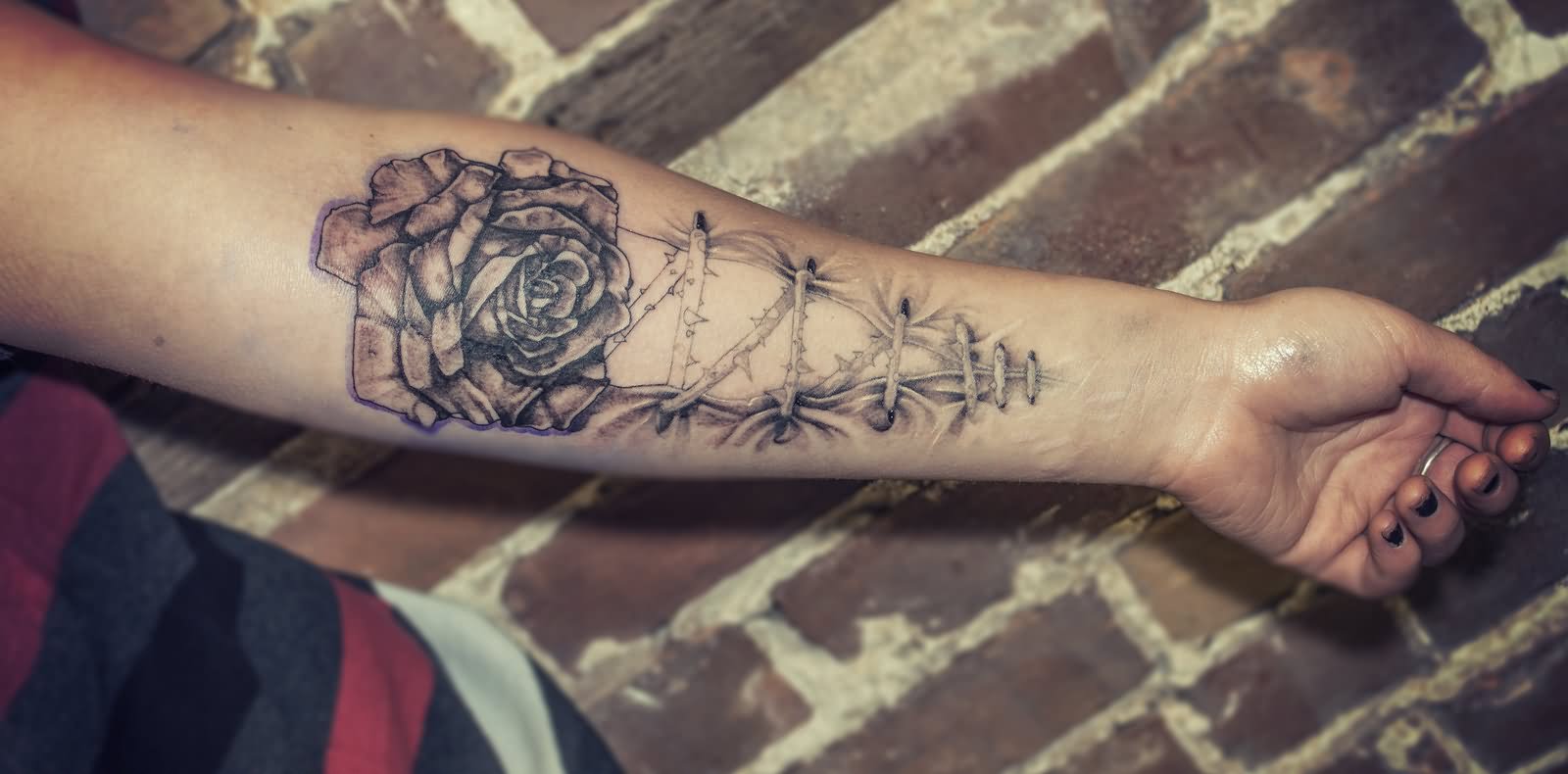 Black And Grey Rose With Corset Tattoo On Forearm By RemiisMeltingDots