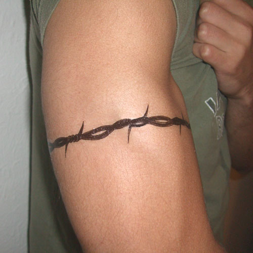 Black Armband Tattoo On Man Right Bicep