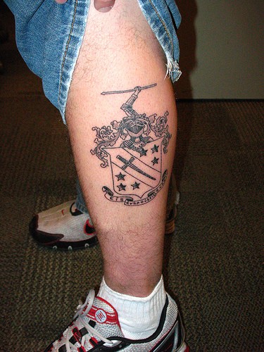 Black Dagger In Family Crest Tattoo On Leg Calf