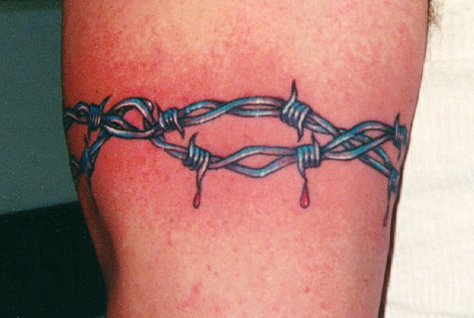 Bleeding Barbed Wire Tattoo On Left Bicep