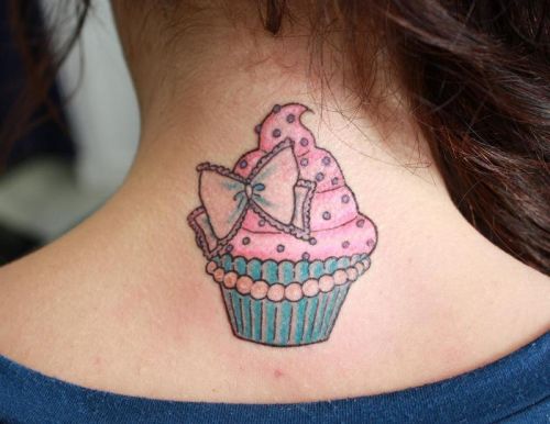 Colorful Cupcake With Bow Tattoo On Girl Back Neck