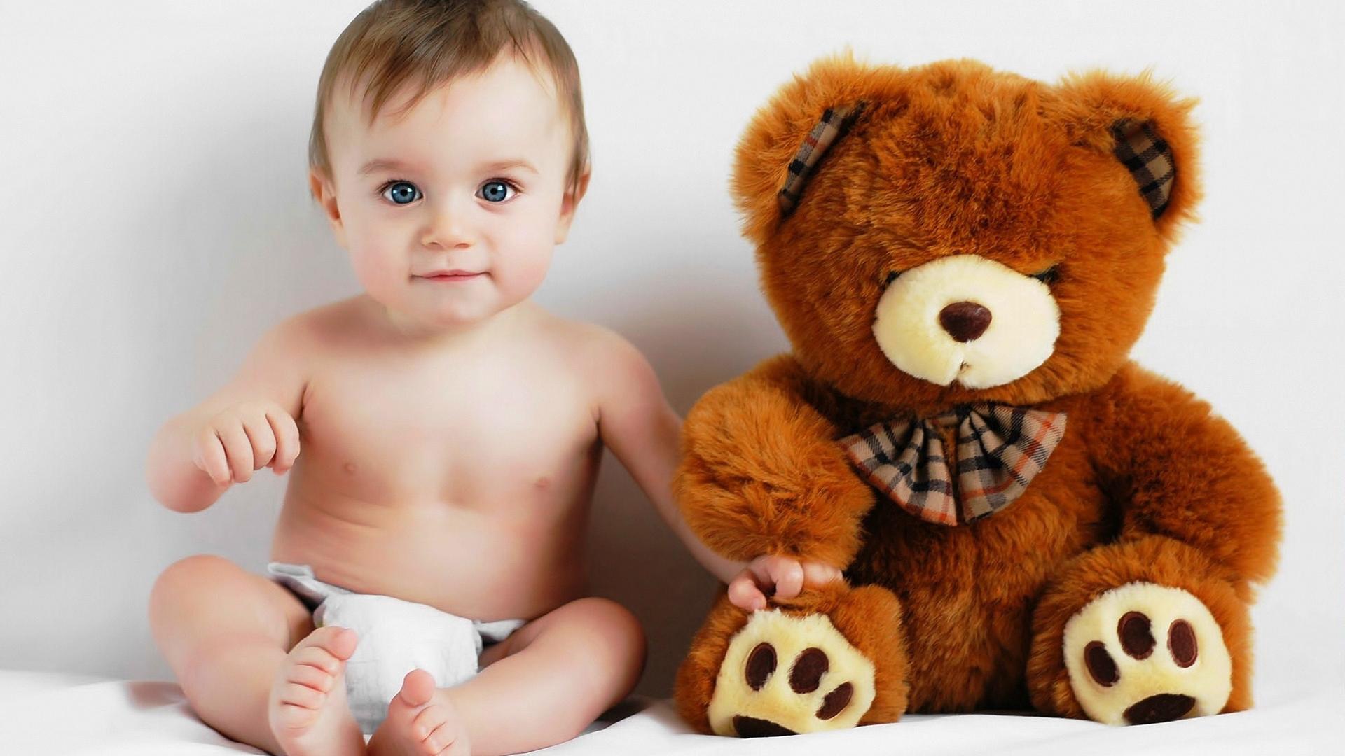Cute Baby Boy With Teddy Bear