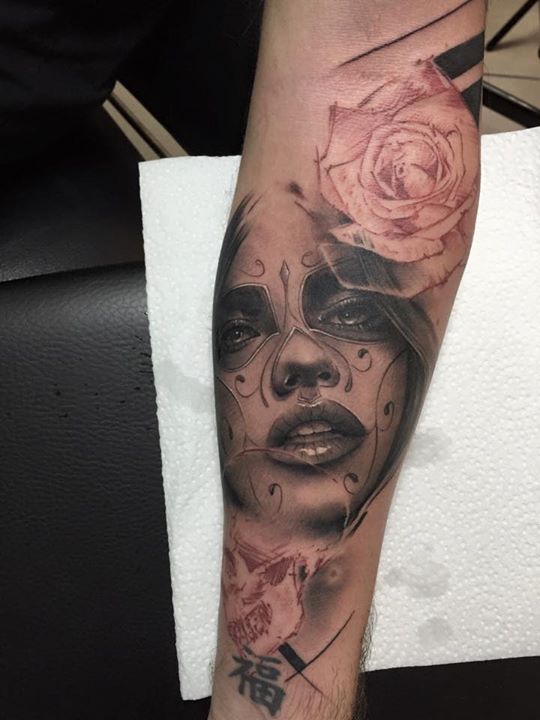 Girl's Portrait With Rose Tattoo on Forearm