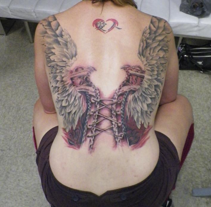 Grey And Pink Corset With Two Eagles Tattoo On Girl Back