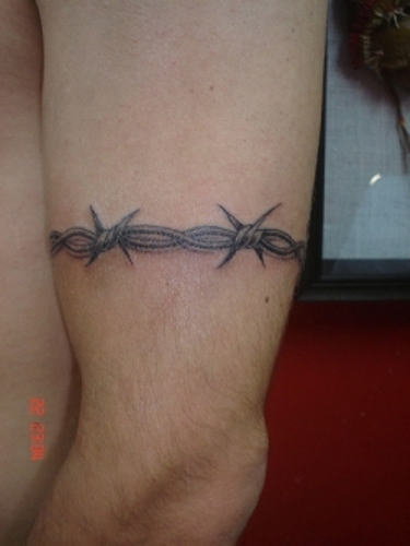 Grey Ink Barbed Wire Tattoo On Left Bicep