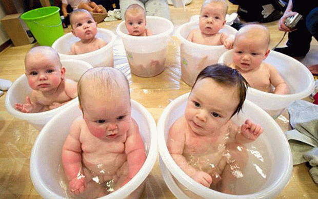 Group Of Babies Bathing Image