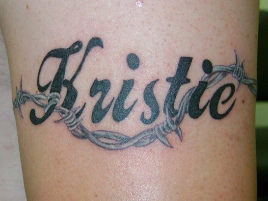 Kristie Barbed Wire Tattoo On Biceps