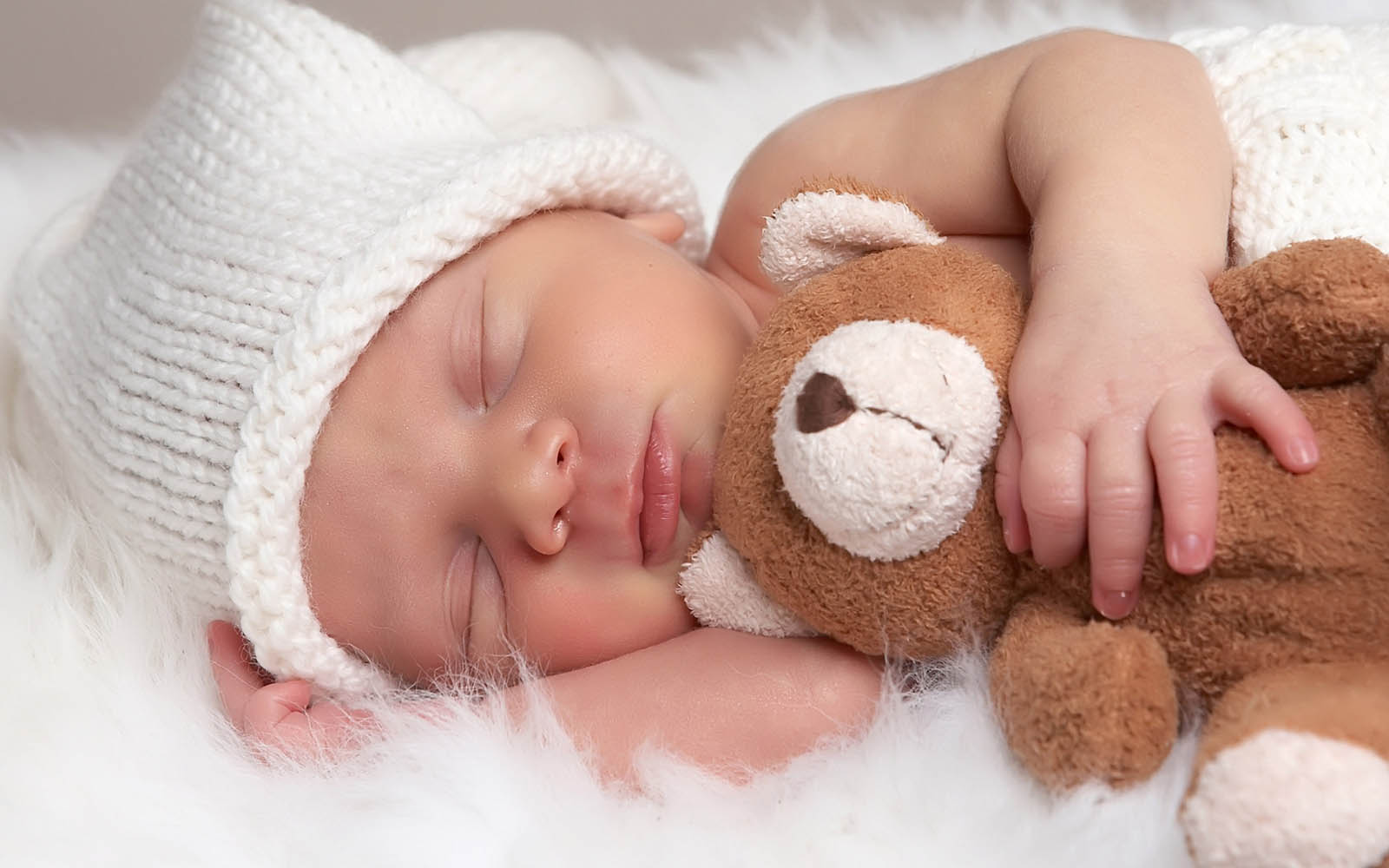 Newborn Baby Sleeping With Teddy Bear