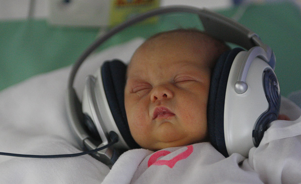 Newborn Baby With Headphones