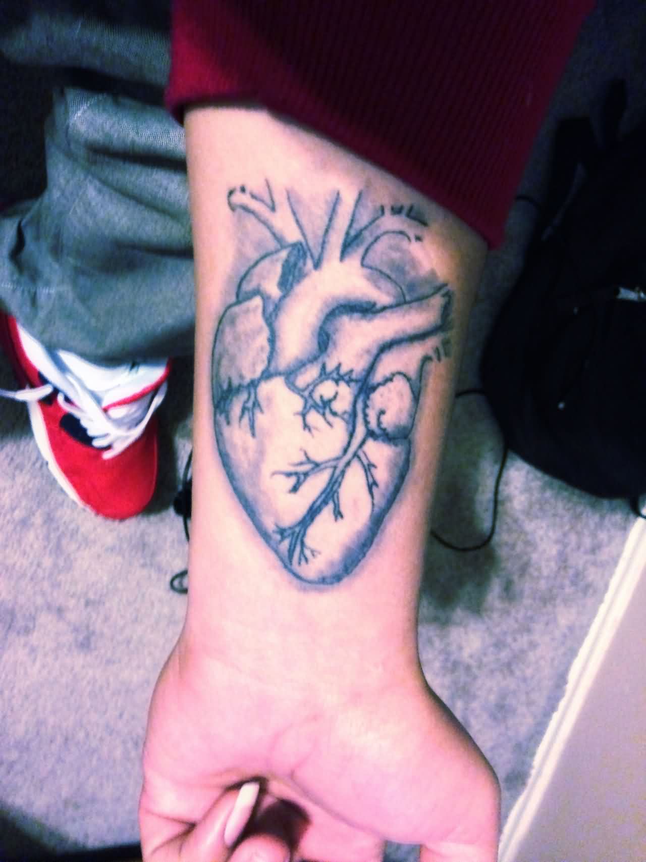 Real Human Heart Tattoo on Forearm