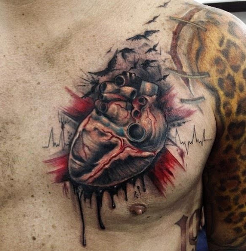 Realistic heart tattoo on left chest