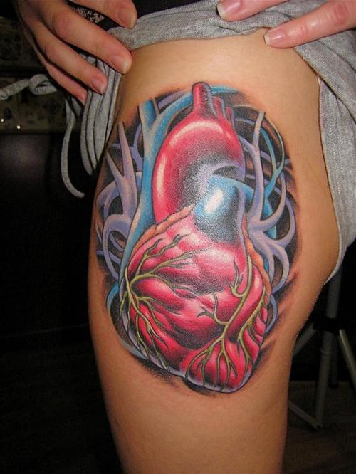Red and Blue Real Heart Tattoo On Leg