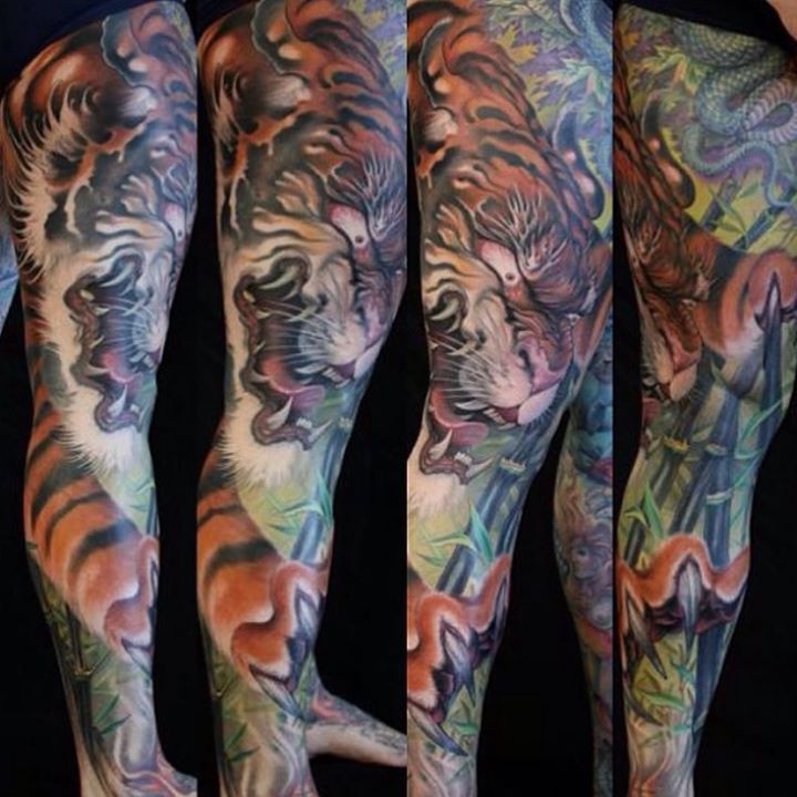 Tiger and Black bamboo tattoo on full leg by Jeff gogue art