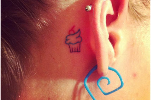 Tiny Cupcake Tattoo On Girl Behind The Ear