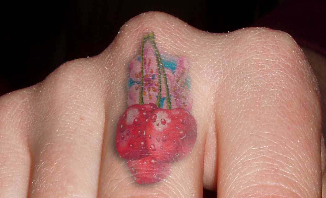 3D Three Red Cherry Tattoo On Finger