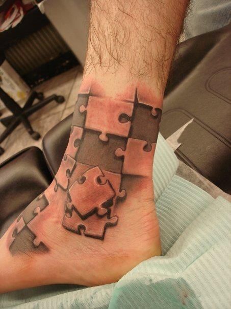 Amazing Black And Grey puzzle Tattoo On Ankle