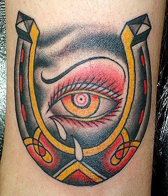 Amazing Colorful Crying Eye In Horseshoe Tattoo On Design