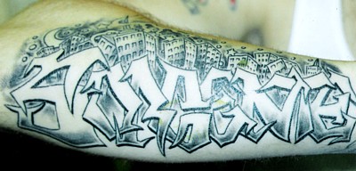 Awesome Graffiti Tattoo On Man Right Sleeve