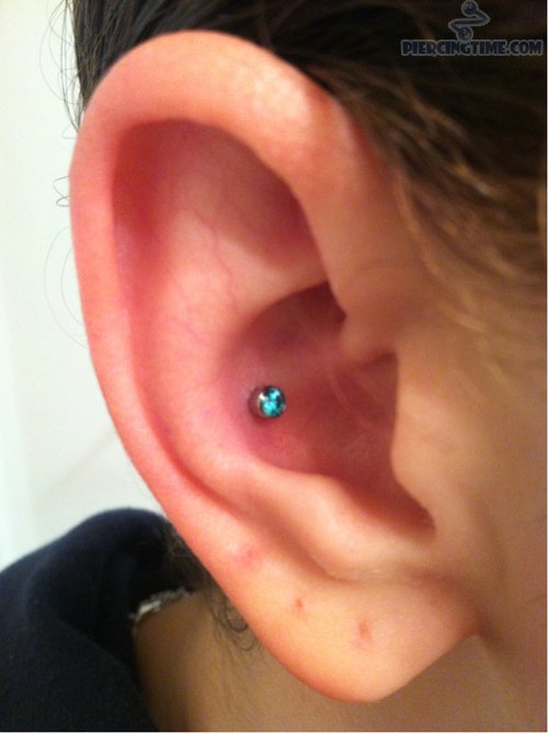 Beautiful Conch Piercing With Blue Stud