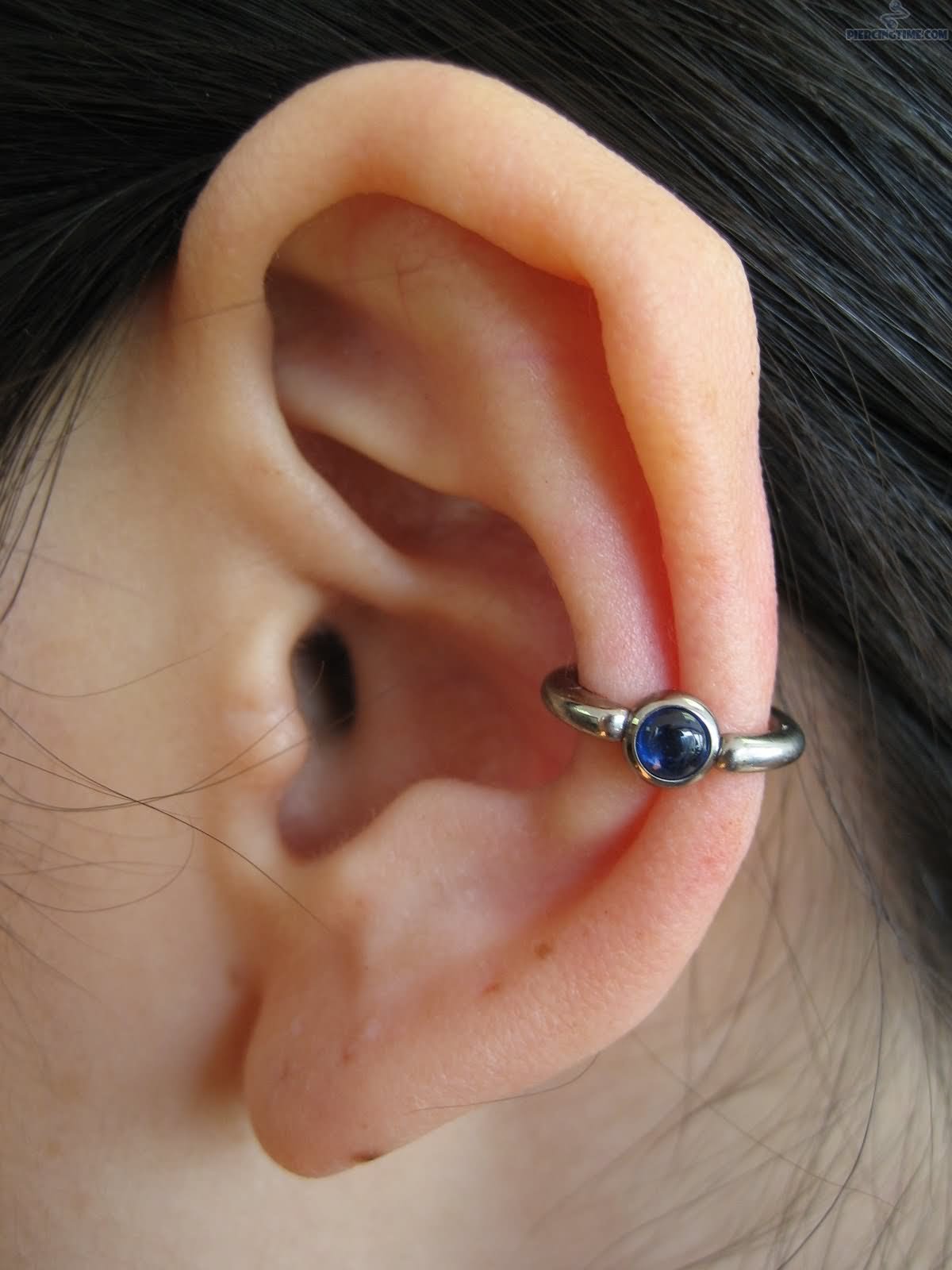 Beautiful Left Ear Conch Piercing Image