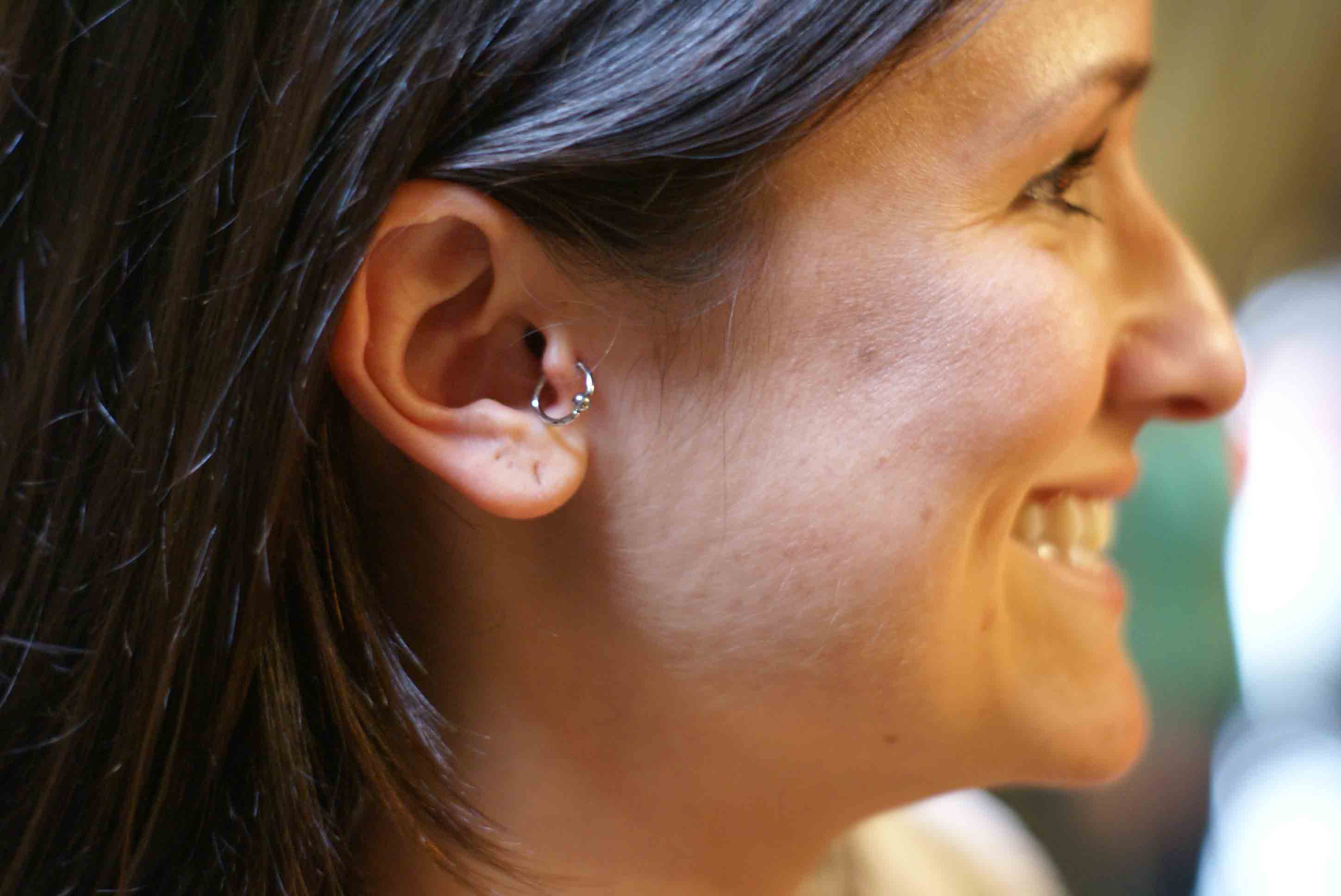 Beautiful Smiling Lady Have Tragus Piercing