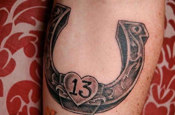 Black 3D Little Heart In Horseshoe Tattoo On Forearm