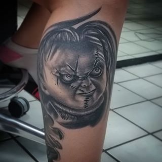 Black And Grey 3D Chucky Face Tattoo On Leg Calf