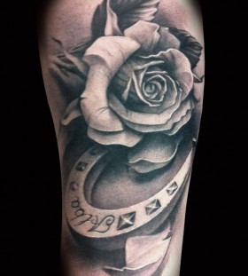 Black And Grey 3D Horseshoe With Rose Tattoo Design