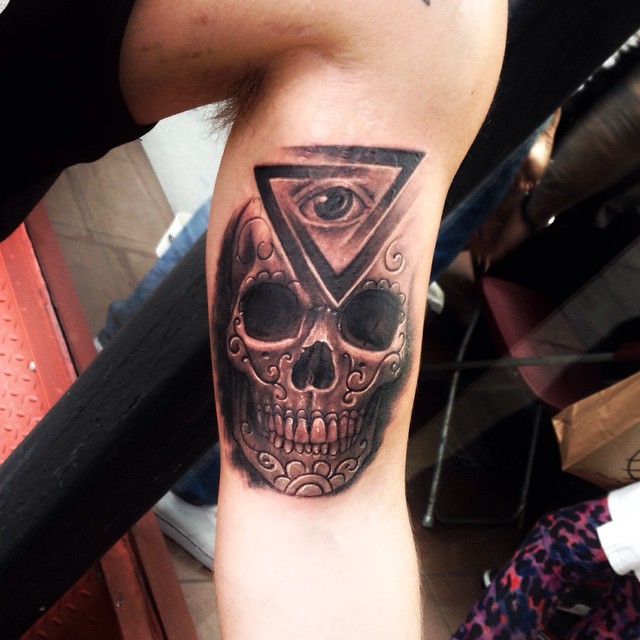 Black And Grey 3D Illuminati Eye On Skull Head Tattoo On Bicep