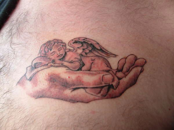 Black And Grey Angel Daughter Sleeping On Hand Tattoo Design