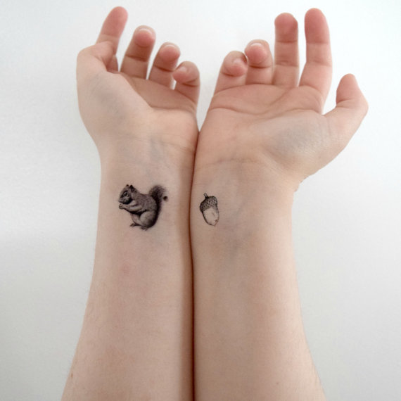Black And Grey Cute Squirrel Tattoo On Wrist