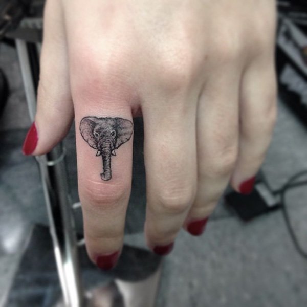 Black And Grey Elephant Head Tattoo On Girl Left Hand Finger